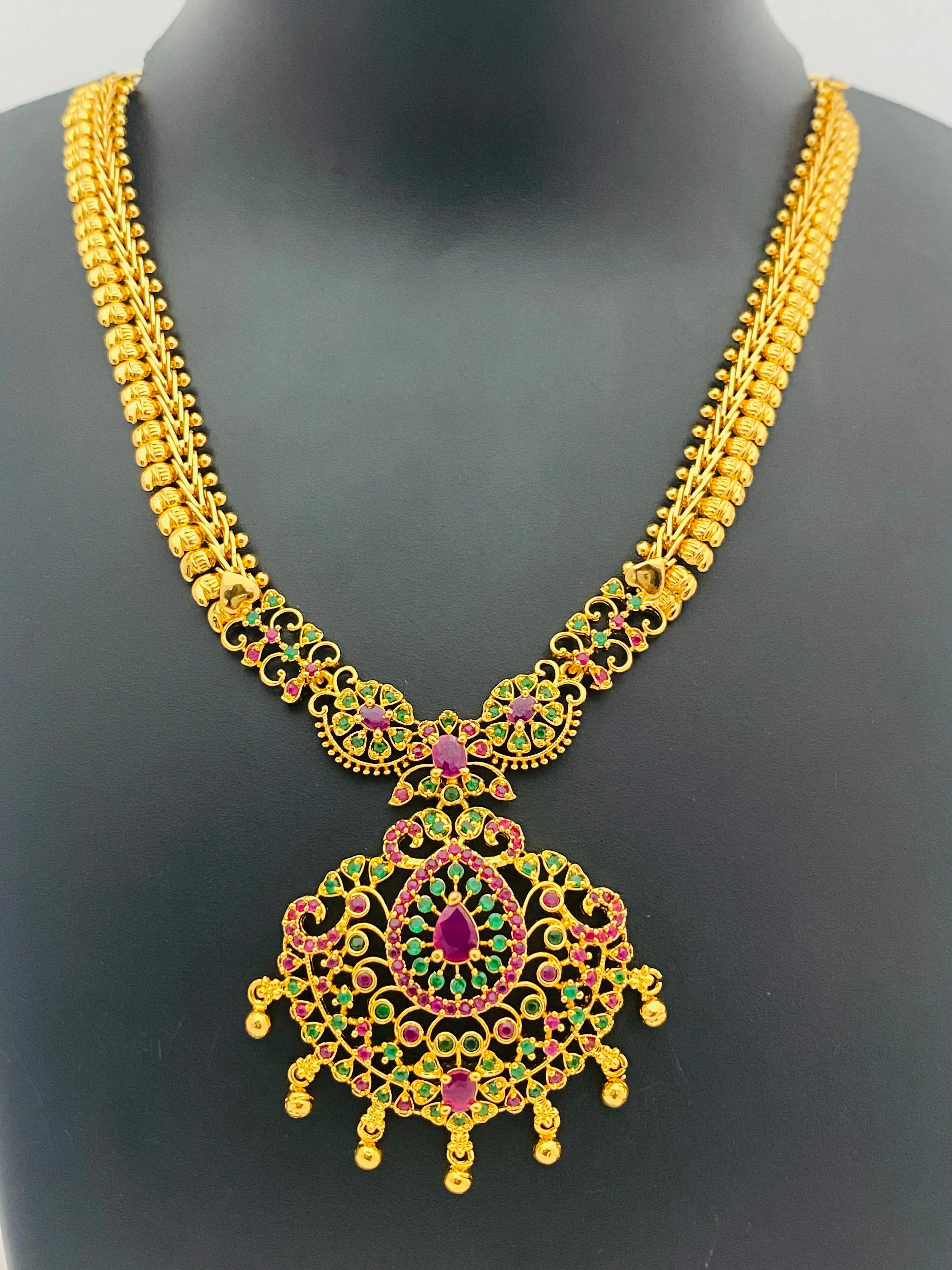 Attractive Party Wear Gold Plated Necklace With Ruby And Emerald Stones And Drops