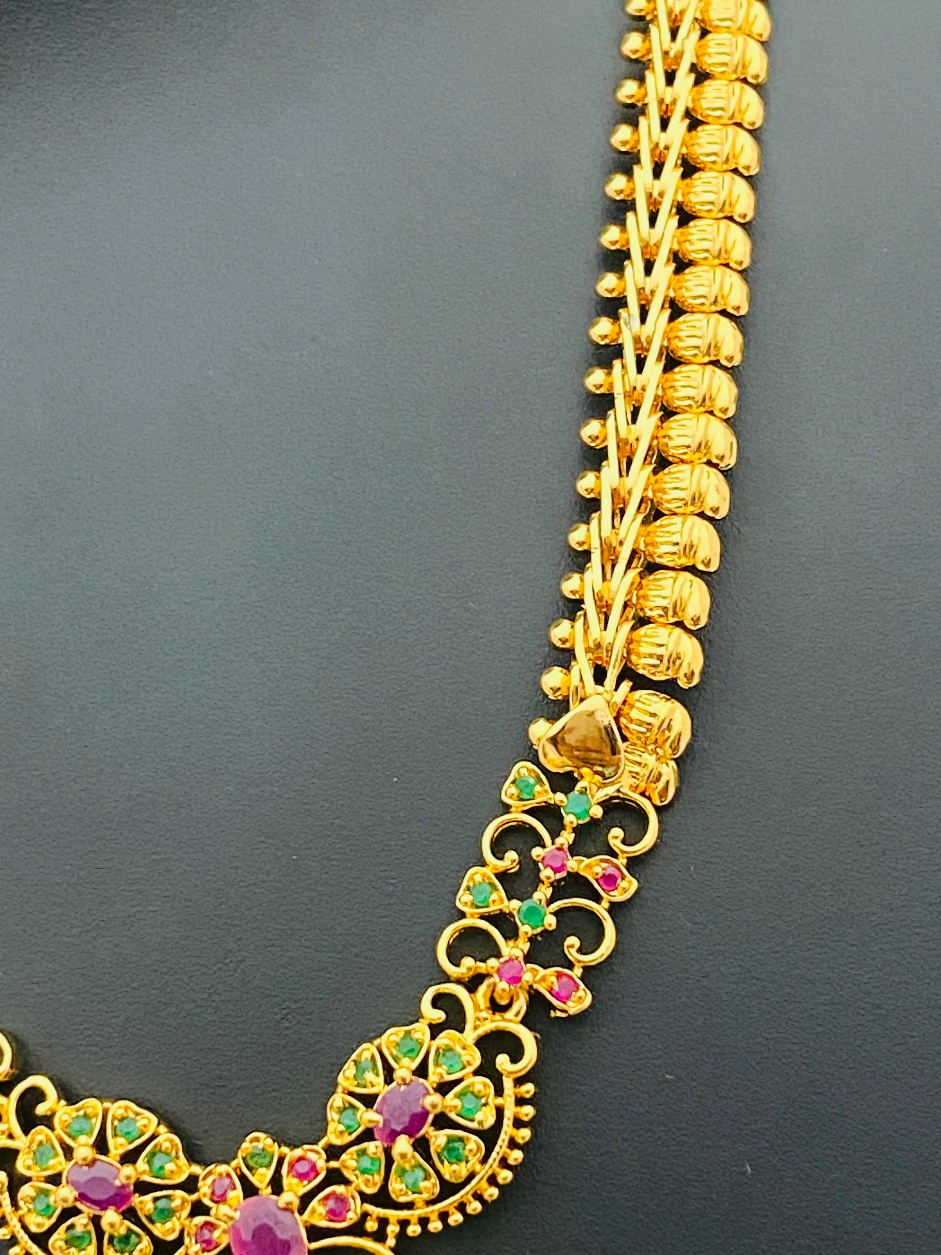 Attractive Party Wear Gold Plated Necklace With Ruby And Emerald Stones And Drops