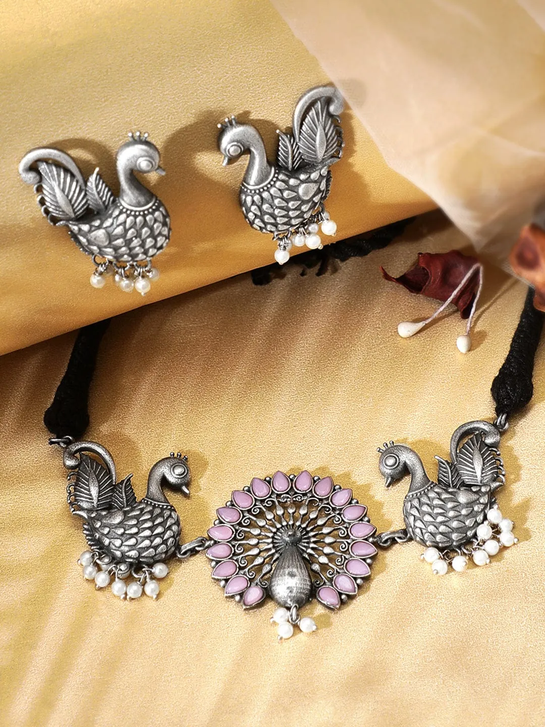 Rubans Oxidised Silver Handcrafted Ruby Studded Peacock Necklace Set.